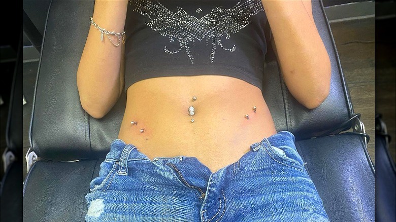 Reclined person with pierced torso