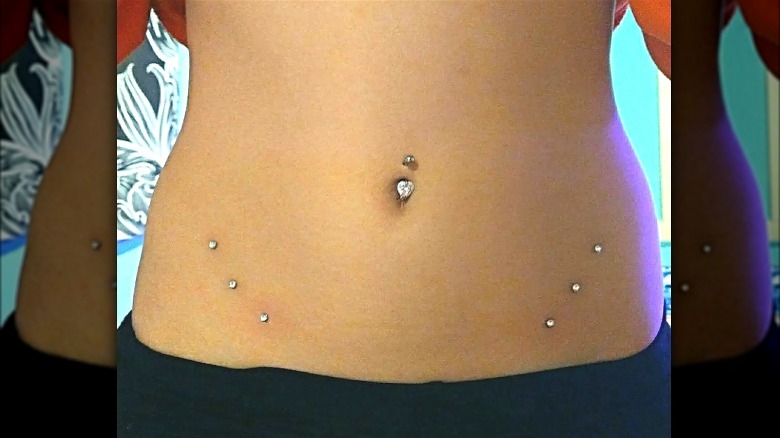 Navel and hip piercings