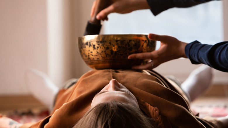 Woman receiving sound therapy