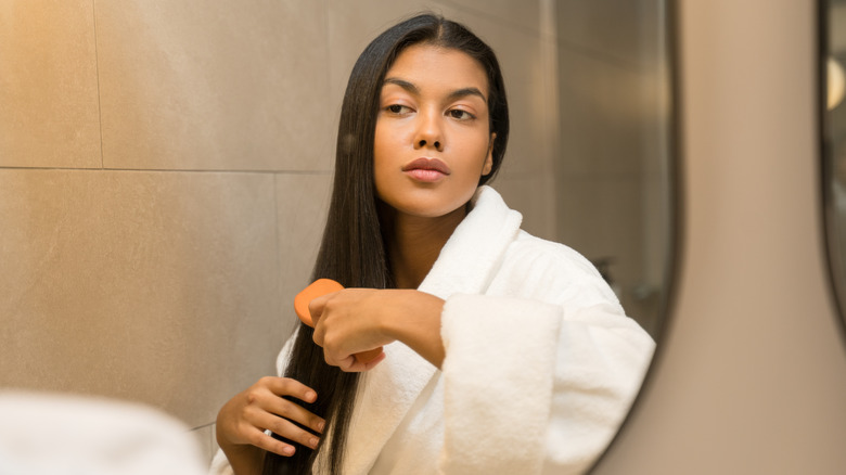 woman brushing hair