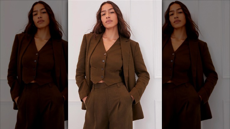 Something Navy model wears tailored brown suit