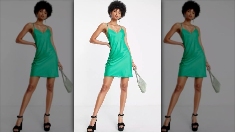Asos model wears tall emerald mini