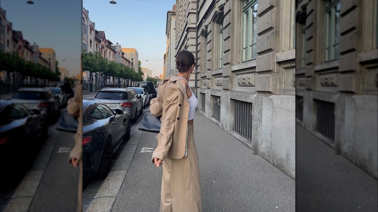 Woman wearing khaki suit, tank