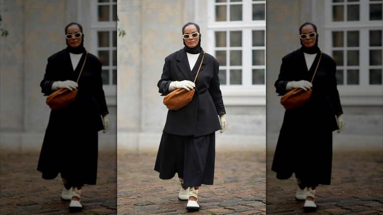 Woman in snow wearing gloves 