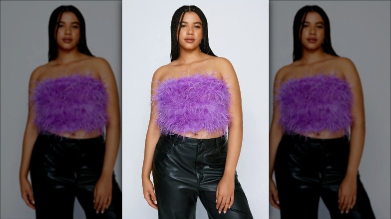 Nasty Gal model wears purple feather top and leather pants