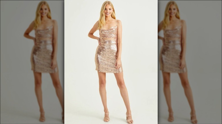 Altar'd State model wears glittery gold dress