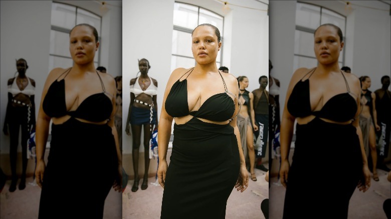 Karoline Vitto model wears cut-out black dress