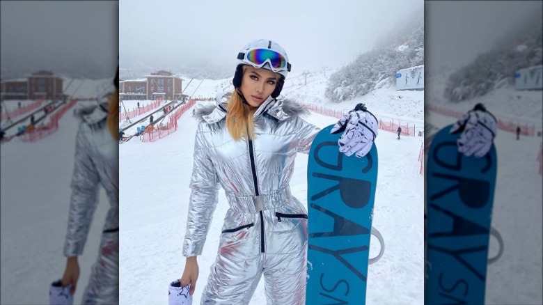 Individual in metallic snowsuit