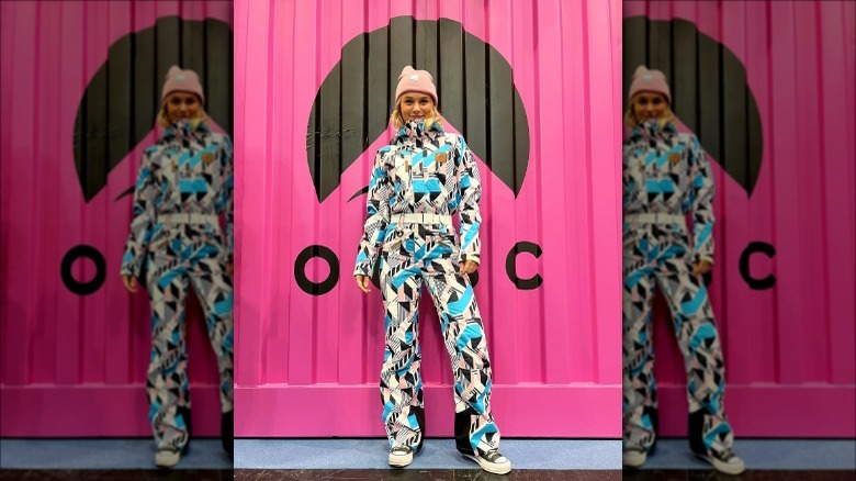 Individual in snowsuit with geometric pattern