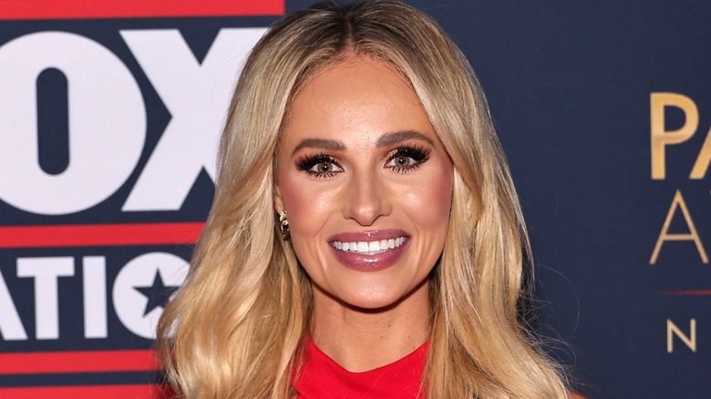 Tomi Lahren wearing full glam makeup on the red carpet.