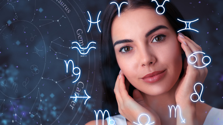 woman circled by zodiac signs