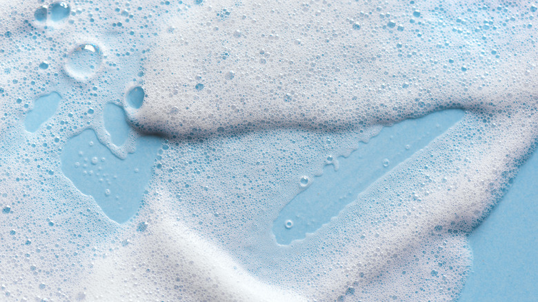Face wash foam with blue background