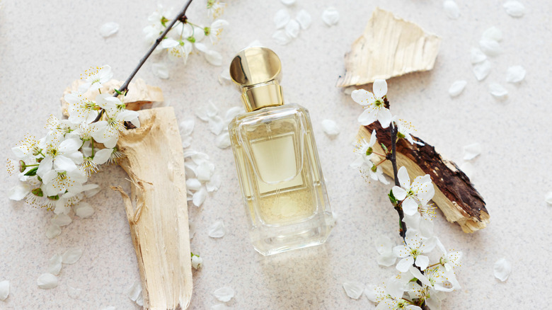 beautiful bottle of perfume with flowers