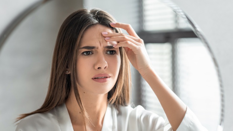 woman in front of a mirror