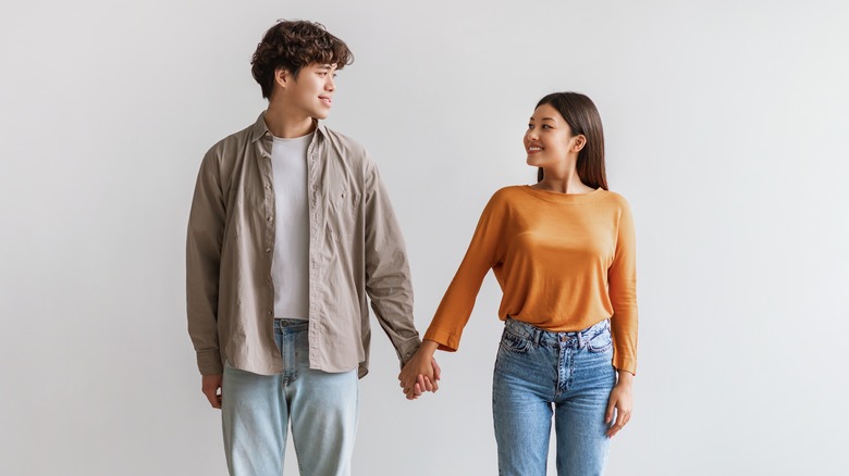 Couple holding hands