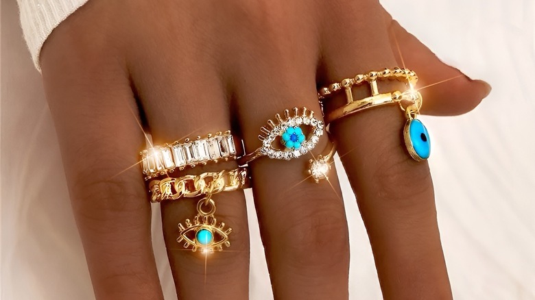 Woman wearing evil eye rings