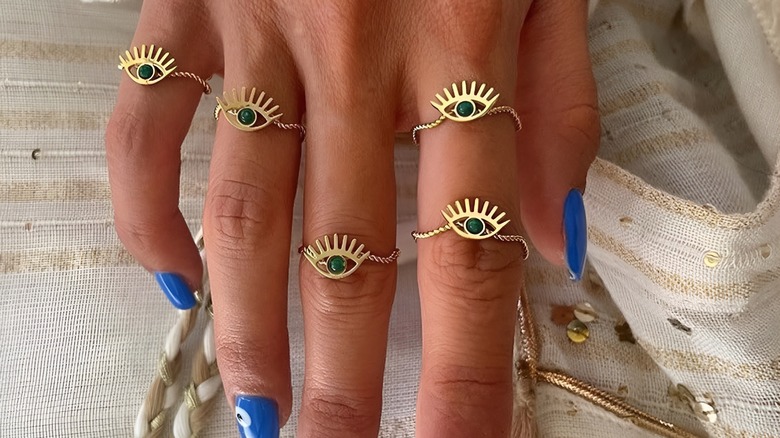 Evil eye rings on fingers