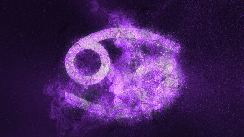 Cancer symbol against the night sky