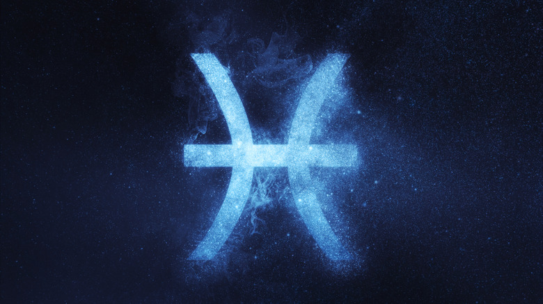 Pisces symbol against the night sky