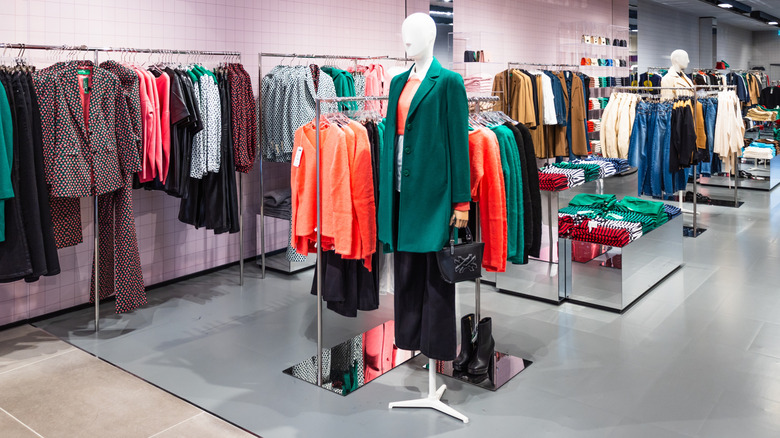 The interior of a Benetton clothing store featuring colorful fashion