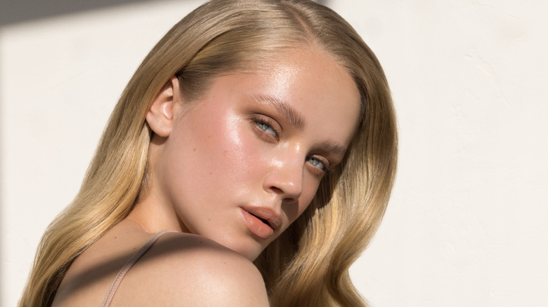 Woman with a glass makeup look