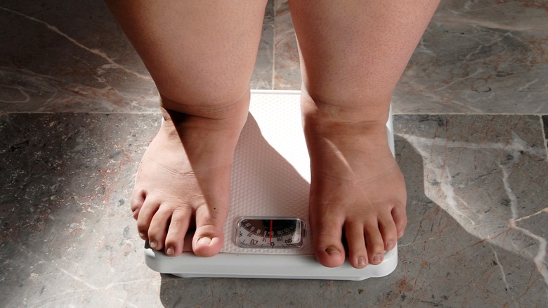 woman standing on a scale