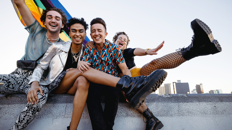 people laughing with pride flag