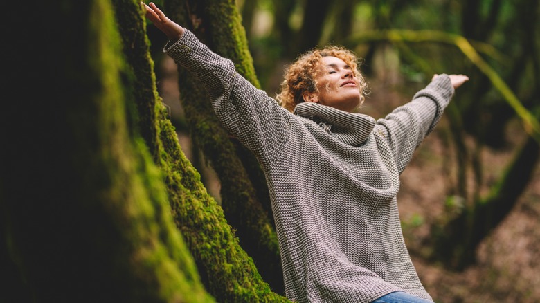 woman smiling in the forest