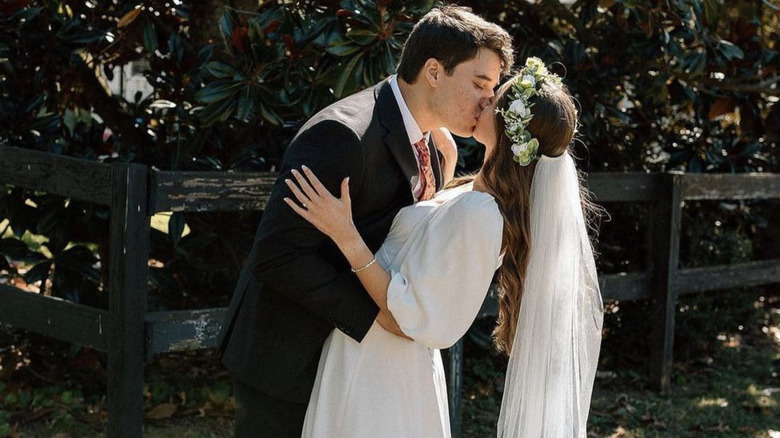 Bride in David's Bridal dress, groom