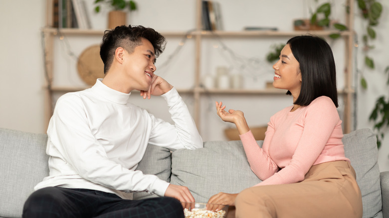 couple smiling and talking