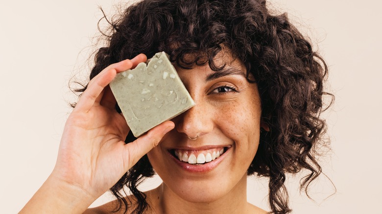 woman holding bar soap