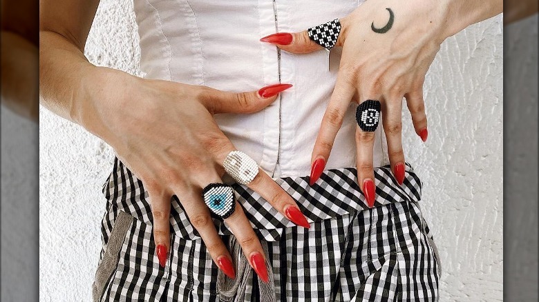 variety of beaded rings on fingers