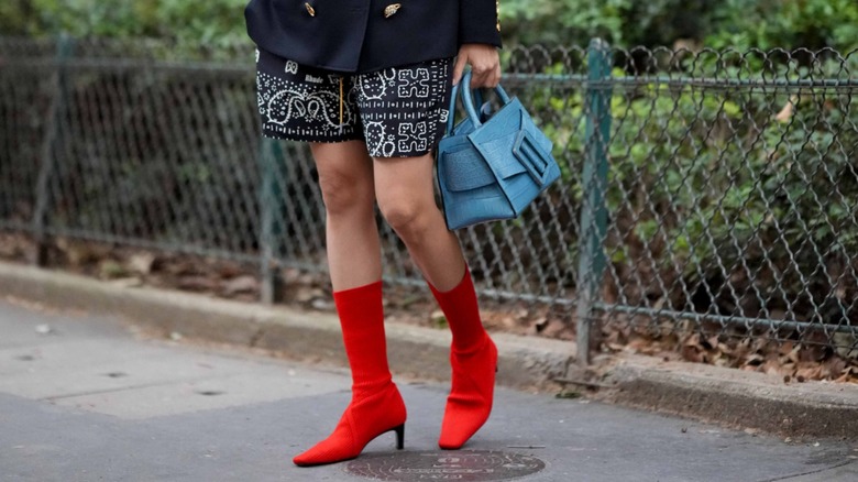 woman wearing red sock boots
