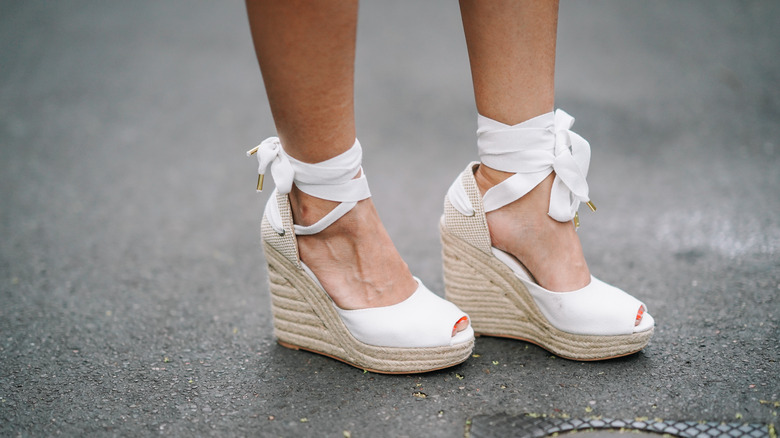 woman wearing white espadrilles