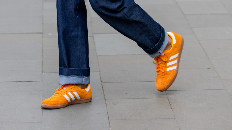 Bright orange and white sneakers