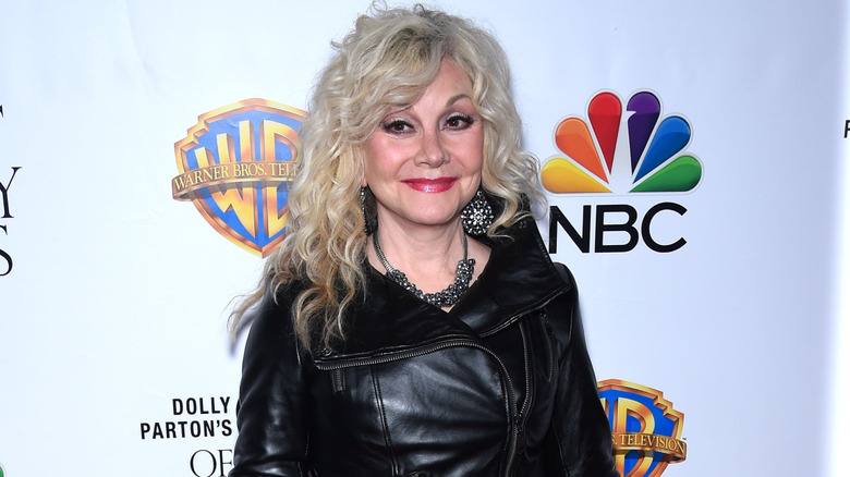 Stella Parton in a black dress arriving at the "Coat of Many Colors" Hollywood Premiere