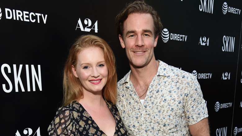 Kimberly and James Van Der Beek smiling