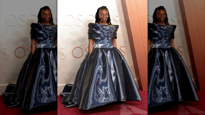 Whoopi Goldberg wearing a liquid-look Christian Siriano gown on the red carpet.