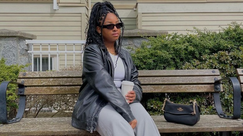 Woman in leather jacket and T-shirt