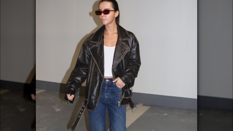 Woman in oversized motorcycle jacket