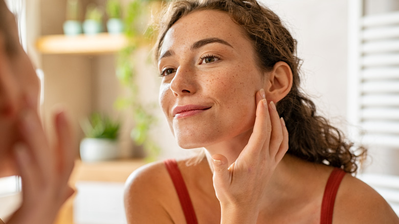 A woman looking in the mirror