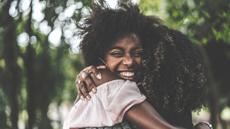 Woman hugging a friend