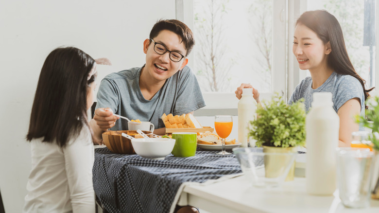 Asian family enjoying a meal