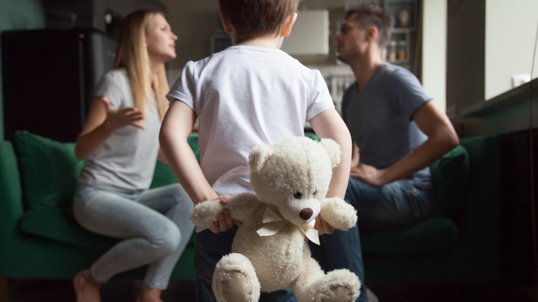 couple fighting while child watches