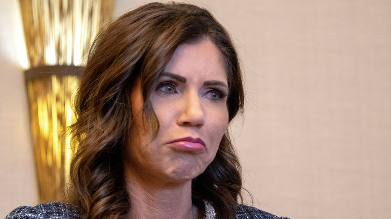 Kristi Noem looking displeased with pursed lips