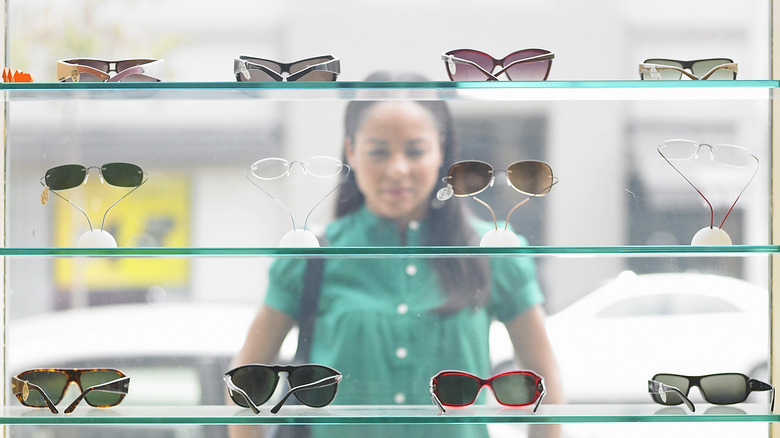 woman looking at sunglasses store