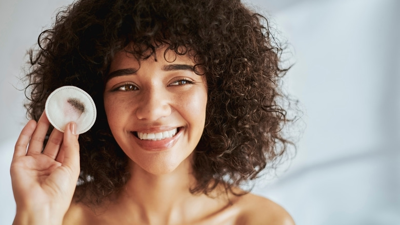 Woman removing makeup