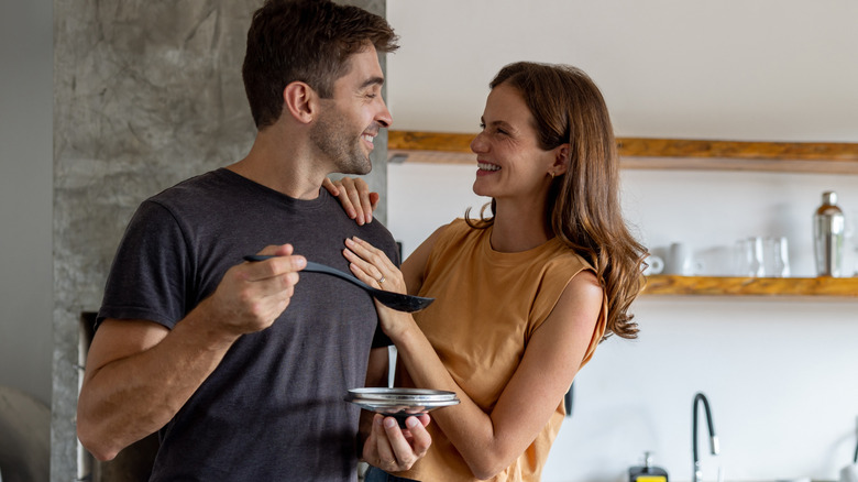 happy couple cooking