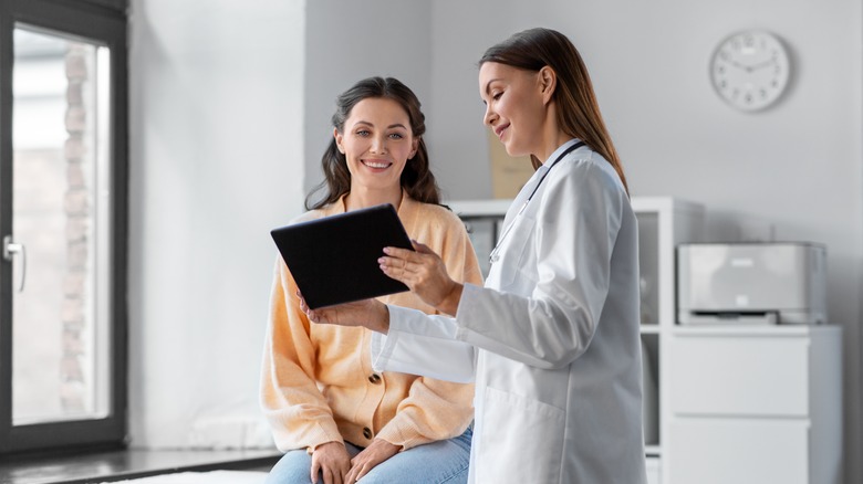 Woman talking to doctor