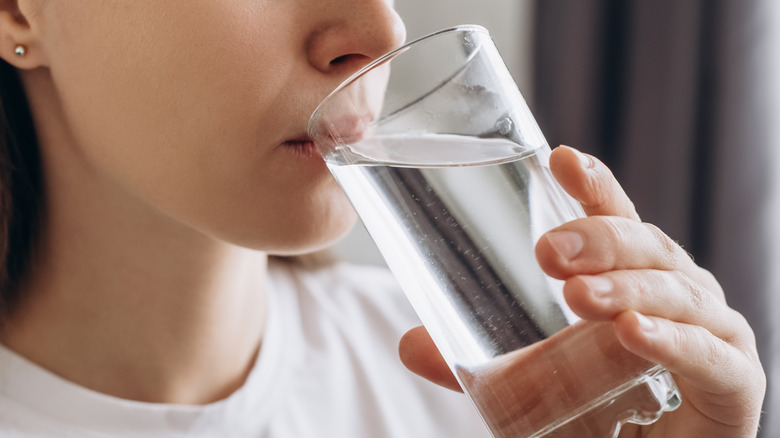 Woman drinking glass of water